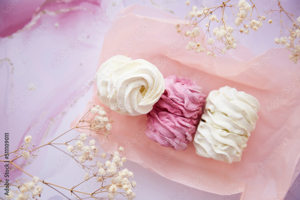 Feminine background, pink and white marshmallow with decoration of gypsophila close up. Cozy winter weekends. Homemade sweets. Top view. Copy space. High quality photo Feminine background, pink and white marshmallow with decoration of gypsophila close up. Cozy winter weekends. Homemade sweets. Top view. Copy space. High quality photo