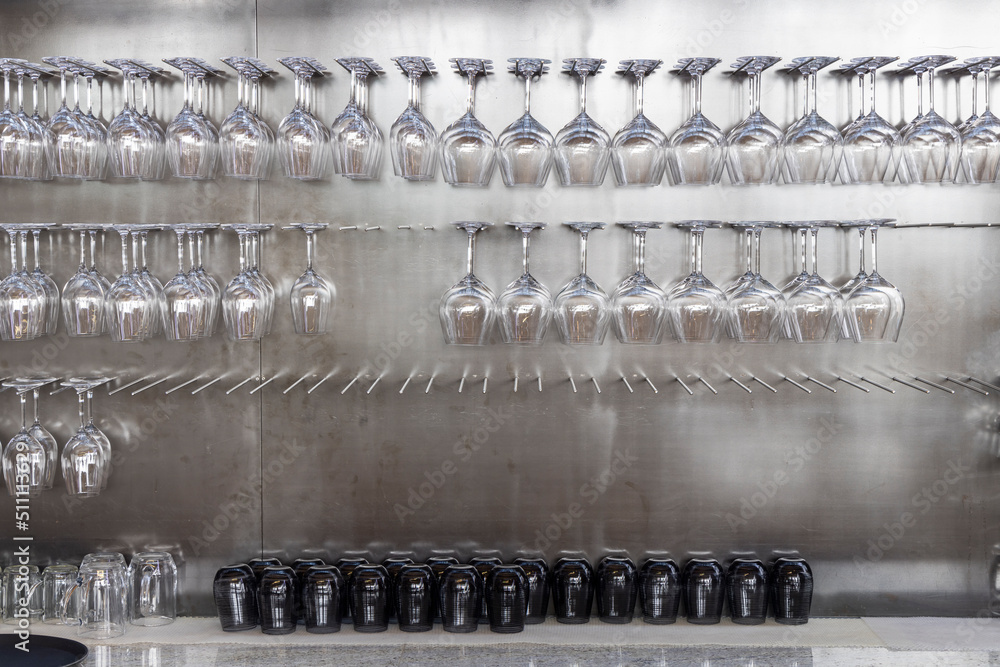 Wine glasses hanging on wall in wine shop Wine glasses hanging on wall in wine shop