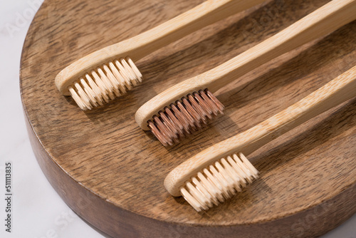 Set of natural wooden toothbrushes wooden tray. Natural bath products and zero waste concept  organic dentifrice. Mockup image