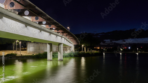 Night landscape of an illuminated bridge over a river