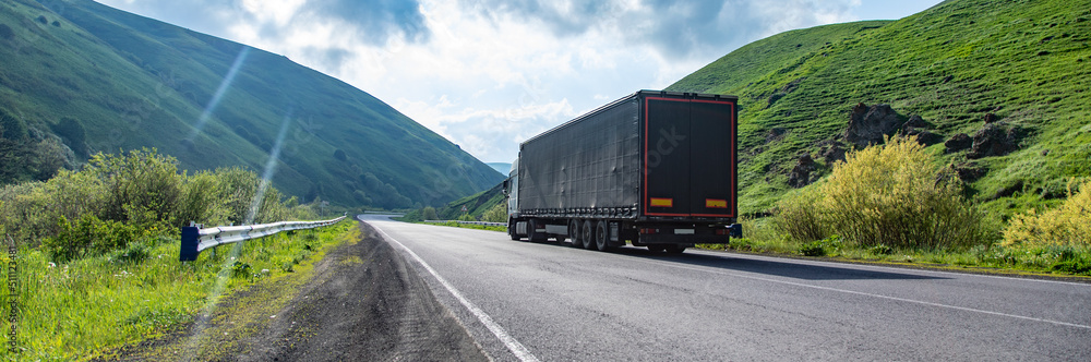 Truck on highway, cargo transportation concept.