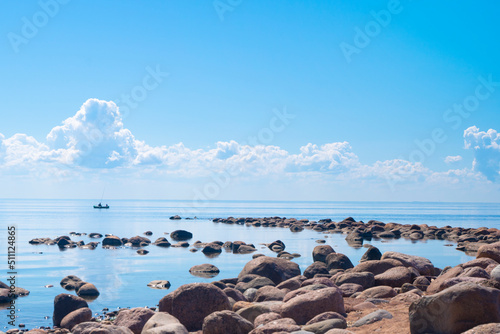 Seascape. Blue sky. Stones in the sea. High quality photo