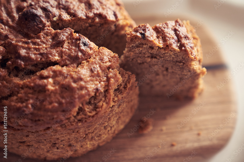 A close-up of a pie where a piece is cut off from the whole part. Diet dessert - Banana cake without milk, gluten-free, egg-free. A close-up of a pie where a piece is cut off from the whole part. Diet dessert - Banana cake without milk, gluten-free, egg-free.