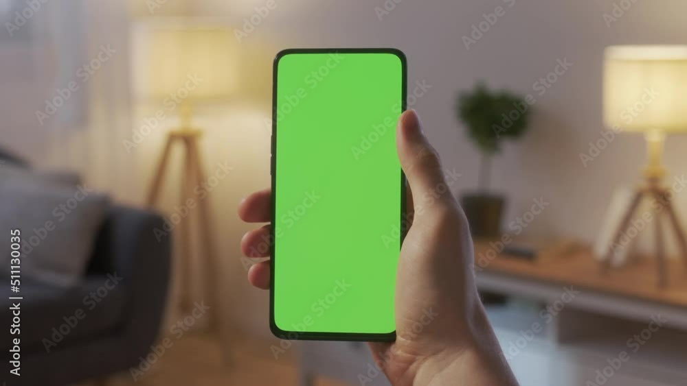 Point of View of Man at Phone with Green Screen for Copy Space. Chromakey Mock Up Without Tracking Markers. Close Up. Boy is Surfing Content With Touching Swiping Up and Tap Center. Point of View of Man at Phone with Green Screen for Copy Space. Chromakey Mock Up Without Tracking Markers. Close Up. Boy is Surfing Content With Touching Swiping Up and Tap Center.
