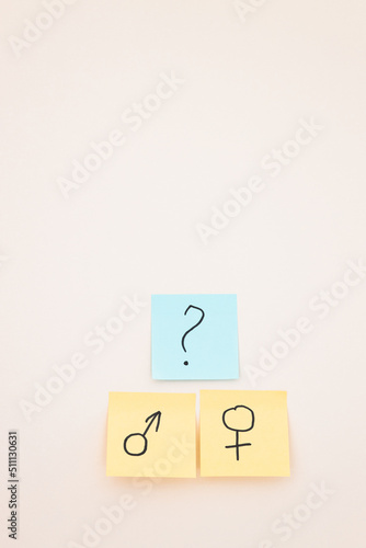 top view of yellow cards with gender identity symbols on white background