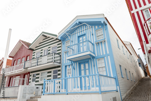Vintage wooden colored striped houses in a resort village in Portugal