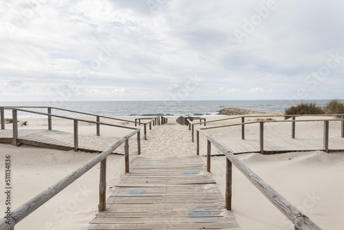 Beautiful sandy beach with wooden walkways by the ocean. Relaxing by the sea