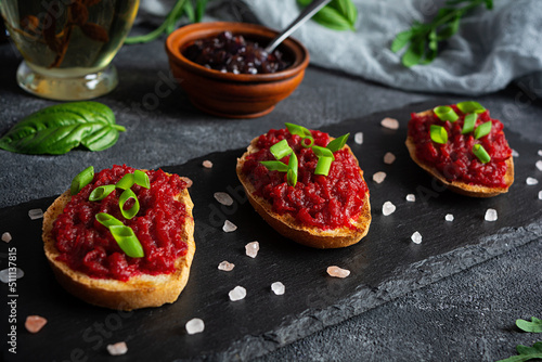Bruschetta with grated beetroot, herbs and caramelized onion