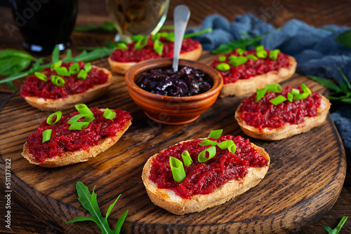 Bruschetta with grated beetroot, herbs and caramelized onion
