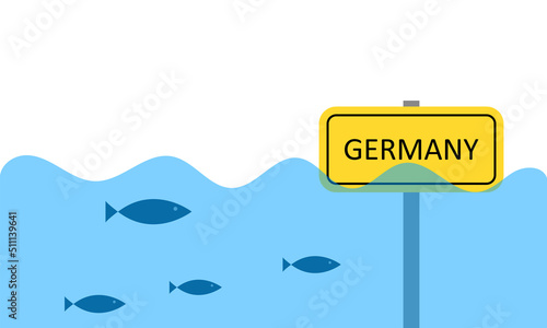 City under water. The sign is half in the water. Extreme climatic situation.