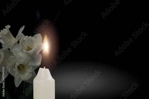 Canvas-taulu A candle burning flame in the darkness and flower