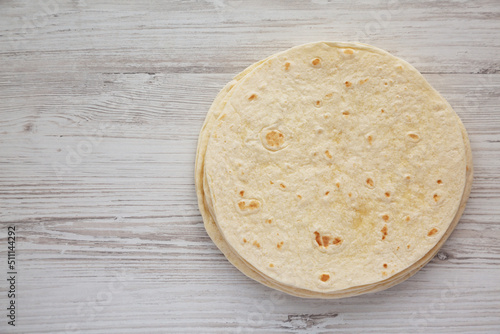 Homemade Mexican Corn Tortillas in a Stack, top view. Flat lay, overhead, from above. Copy space. photo