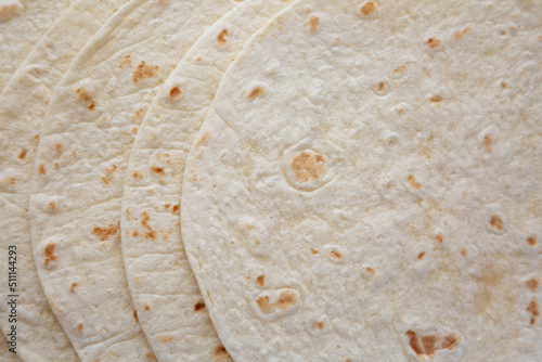 Homemade Mexican Corn Tortillas in a Stack, top view. Flat lay, overhead, from above.