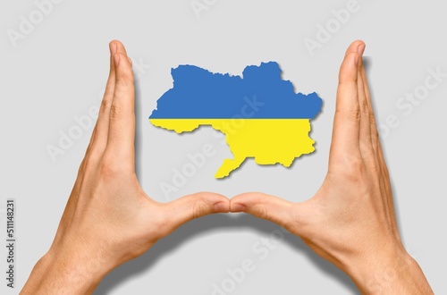 A ukraine country in ukraine flag color in hand.