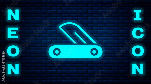 Glowing neon Swiss army knife icon isolated on brick wall background. Multi-tool, multipurpose penknife. Multifunctional tool. Vector