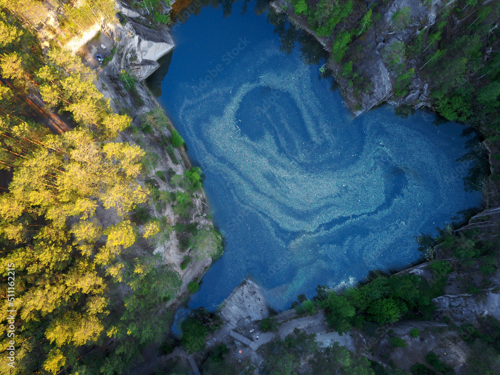 a heart-shaped lake in the mountains.photo from a bird's eye view