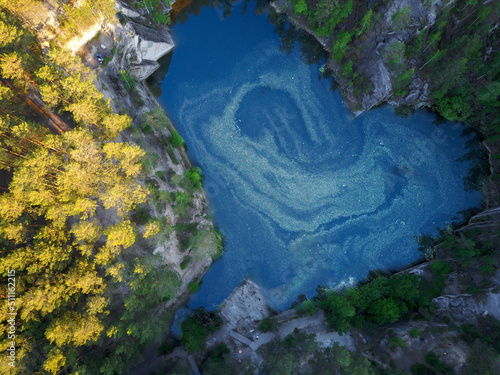 a heart-shaped lake in the mountains.photo from a bird's eye view
