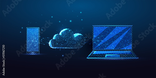 Futuristic cloud strorage concept with glowing low polygonal laptop, smartphone and cloud on blue  photo