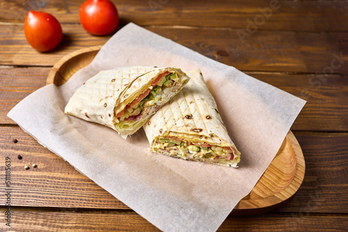 Shawarma cut in half on a plate