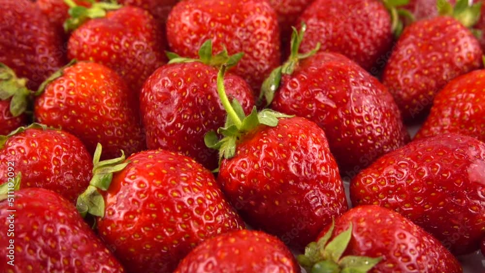 Splashes of water fall on strawberries. Splashes of water fall on strawberries.