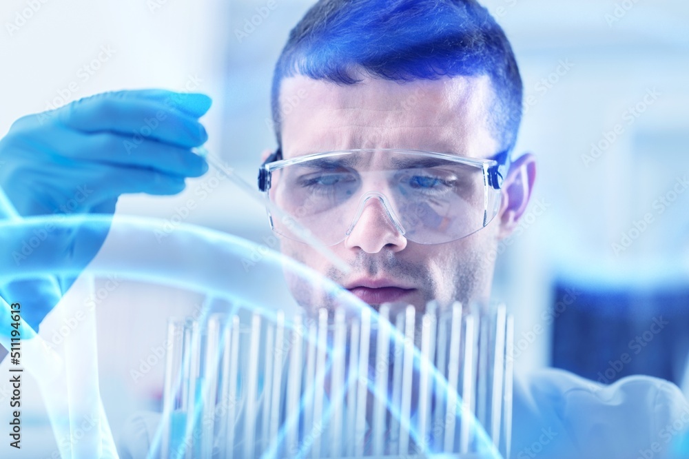 Scientist with tube pcr and virtual screen with data scientific at genetic engineering lab. Biomedical engineer genetic working with tubes in biotechnical laboratory Scientist with tube pcr and virtual screen with data scientific at genetic engineering lab. Biomedical engineer genetic working with tubes in biotechnical laboratory
