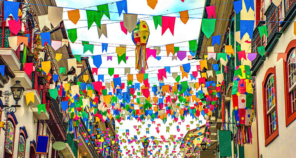 Brazilian june party (festas juninas) street decoration, with colorful flags and balloons
