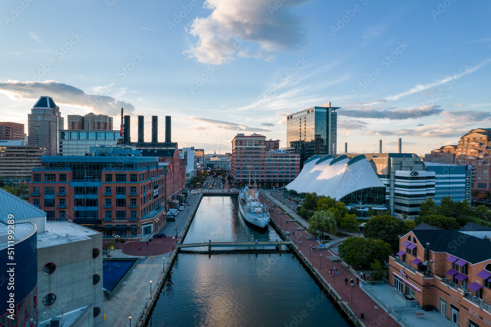 Aerial Drone View of Baltimore City Inner Harbor before Sunset with Blue Skies