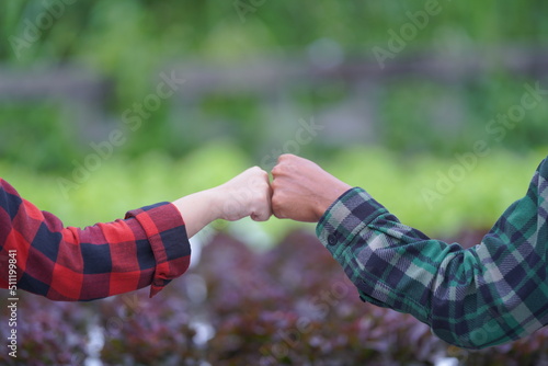 couple holding hands together. handshake between two businessmen. close up of two hands shaking hands