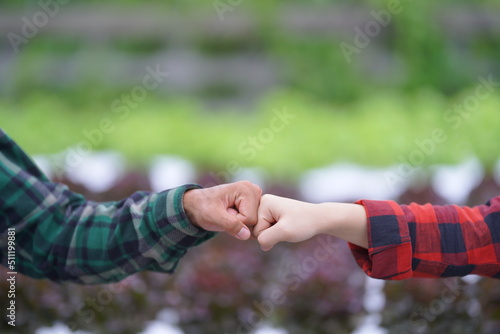 couple holding hands together. handshake between two businessmen. close up of two hands shaking hands
