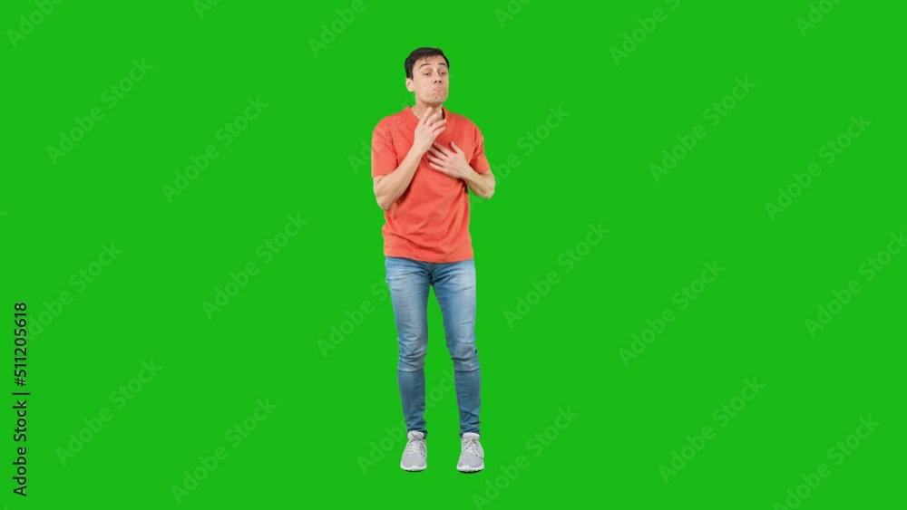 Frustrated man trying to hide mistakes. Green background Frustrated man trying to hide mistakes. Green background
