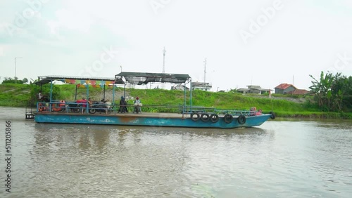 Wallpaper Mural Take a big boat to cross the Brantas River in Jombang, East Java, Indonesia, this boat transports passengers and vehicles Torontodigital.ca
