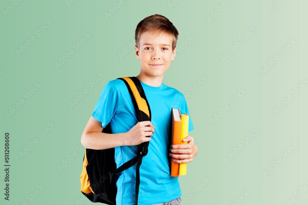 Smiling male student with backpack and textbooks Smiling male student with backpack and textbooks