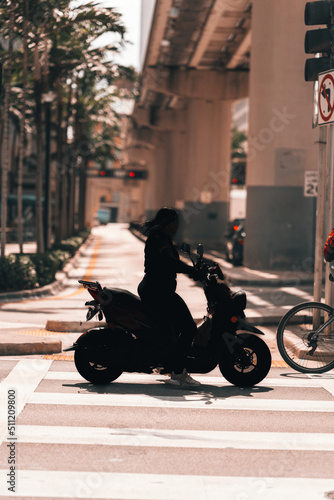 motorcycle on the street woman morning miami downtown 