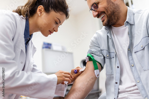 Fotografija Preparation for blood test by female doctor medical uniform on the table in white bright room