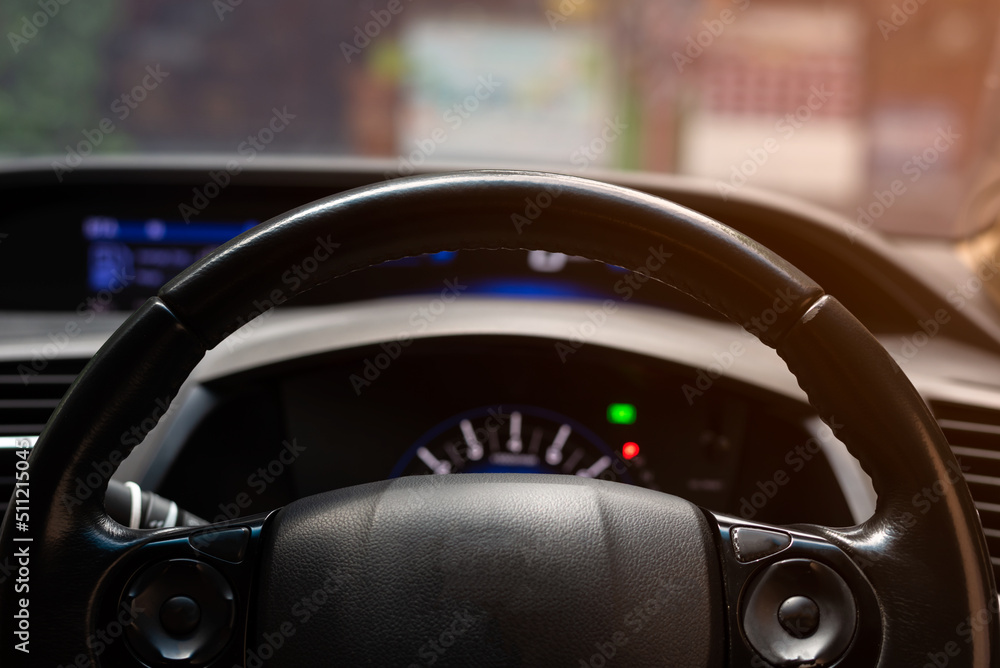 Look through a car steering wheel.