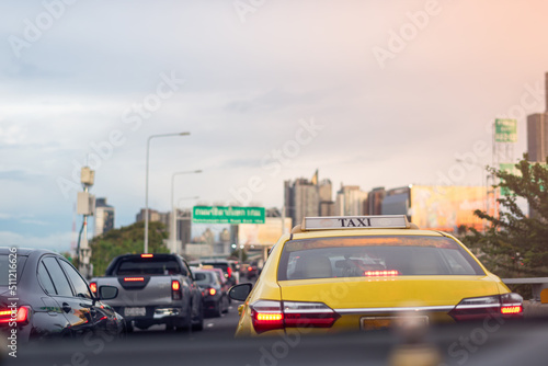 Bangkok, Thailand - May 10, 2022 : Taxi in Traffic jam on toll way, Bangkok, Thailand. Selective focus.