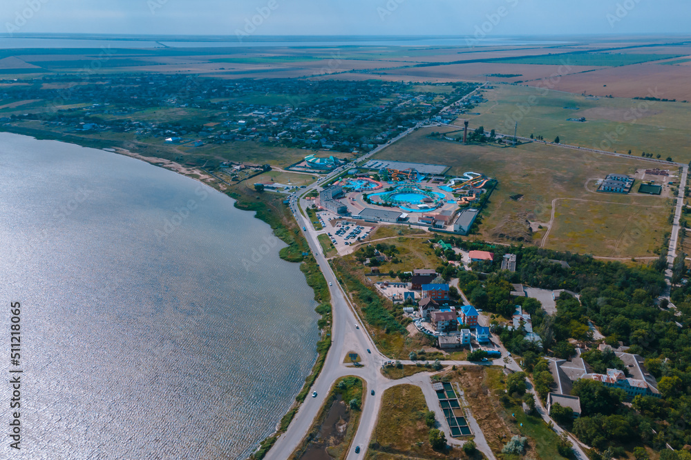 Top view of hotel-type houses on the coast of the Sea of ​​Azov. Rest on the seashore. Resort place. 