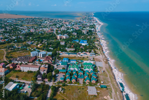 Top view of hotel-type houses on the coast of the Sea of ​​Azov. Rest on the seashore. Resort place. "Fedotov braid". located in Kyrylivka in southern Ukraine