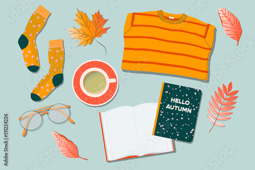 Sweater, tea cup, glasses, socks, leaves and note book on a table. Trendy top down view illustration. Autumn atmosphere. Modern minimalistic hand drawn group of things design for web card, banner.