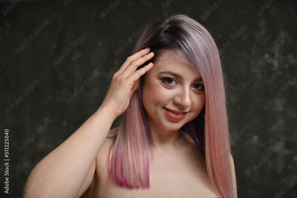 Fototapeta premium portrait of a blonde woman with dyed hair with a smile