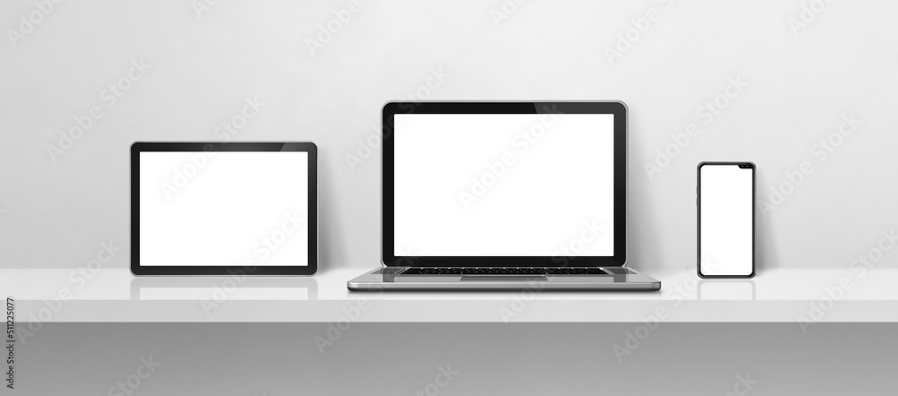 Laptop, mobile phone and digital tablet pc on white concrete wall shelf. Banner background Laptop, mobile phone and digital tablet pc on white concrete wall shelf. Banner background