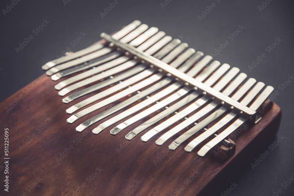 Traditional wooden kalimba isolated on black