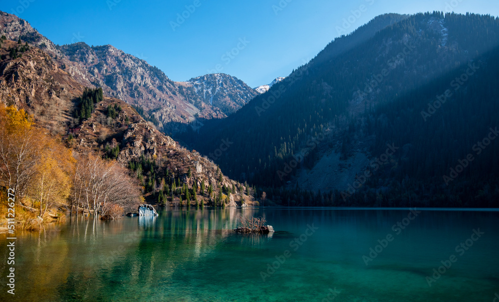 Fantastic morning panorama mountains lake. Picturesque autumn sunrise. Beauty of nature concept background. Mountain landscape, lake and mountain range, Altai.