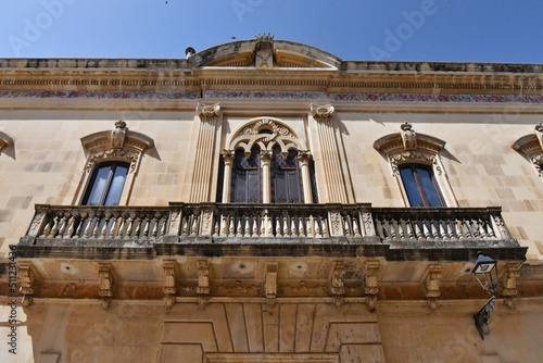 The balcony of an old Baroque style house in Presicce, a village in the Puglia region of Italy. photo