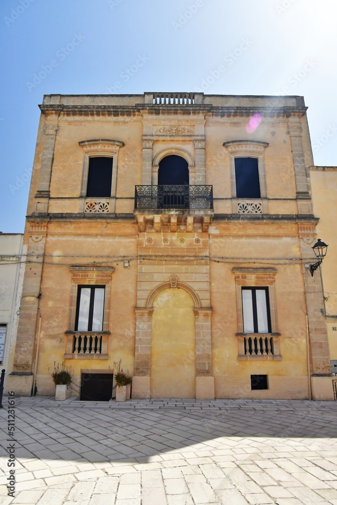 The balcony of an old Baroque style house in Presicce, a village in the Puglia region of Italy.