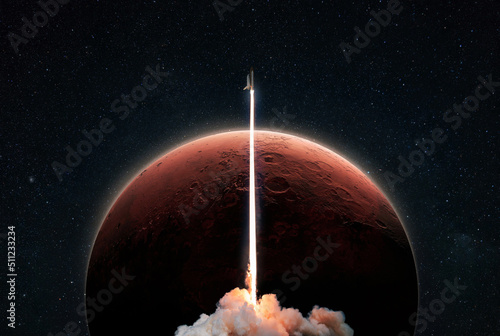 Fototapeta Naklejka Na Ścianę i Meble -  New space shuttle rocket with a blast takes off into space against the background of the red planet Mars and explores space. Concept of technology and travel to other planets. Spaceship lift off