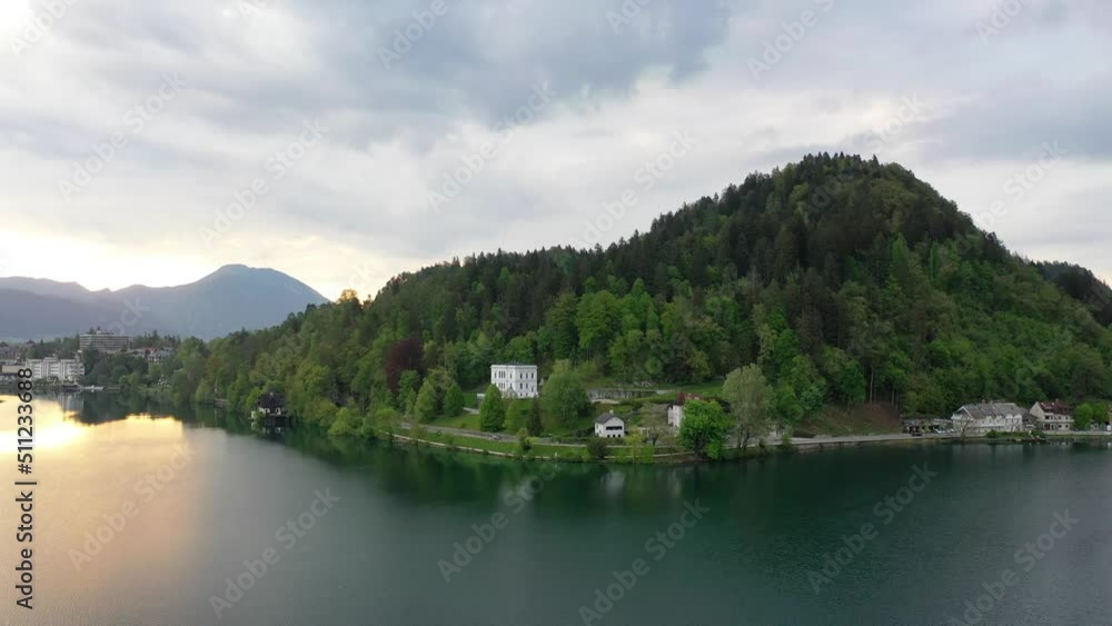 Sunrise on Lake Bled. Slovenia. Lake Bled on a beautiful autumn morning. Sunrise in the hills after a misty night. Sunrise on Lake Bled. Slovenia. Lake Bled on a beautiful autumn morning. Sunrise in the hills after a misty night.