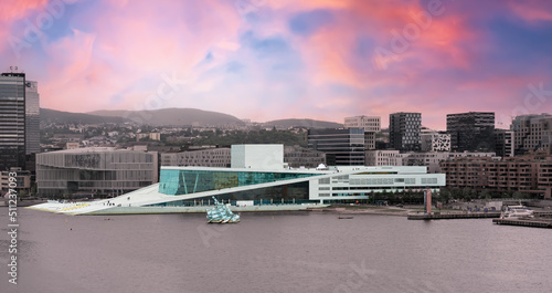 Oslo, Norway - June 6th 2022: The Oslo National Opera House by the water on a summers evening. photo