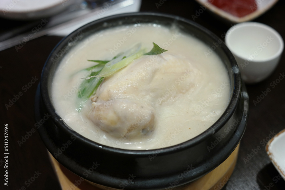 Korean traditional nutritious chicken dish stuffed with ginseng, jujube and glutinous rice and simmered until tender.