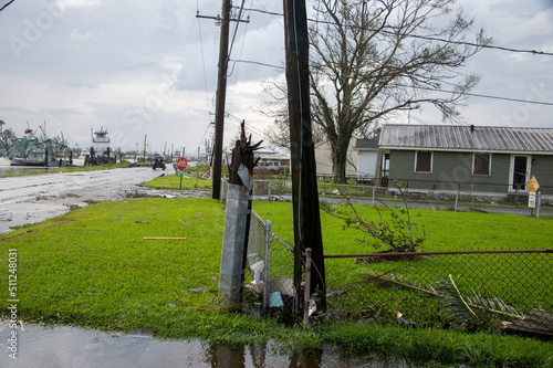 Utility Pole Broken And Moved To Fence Hurricane Ida photo